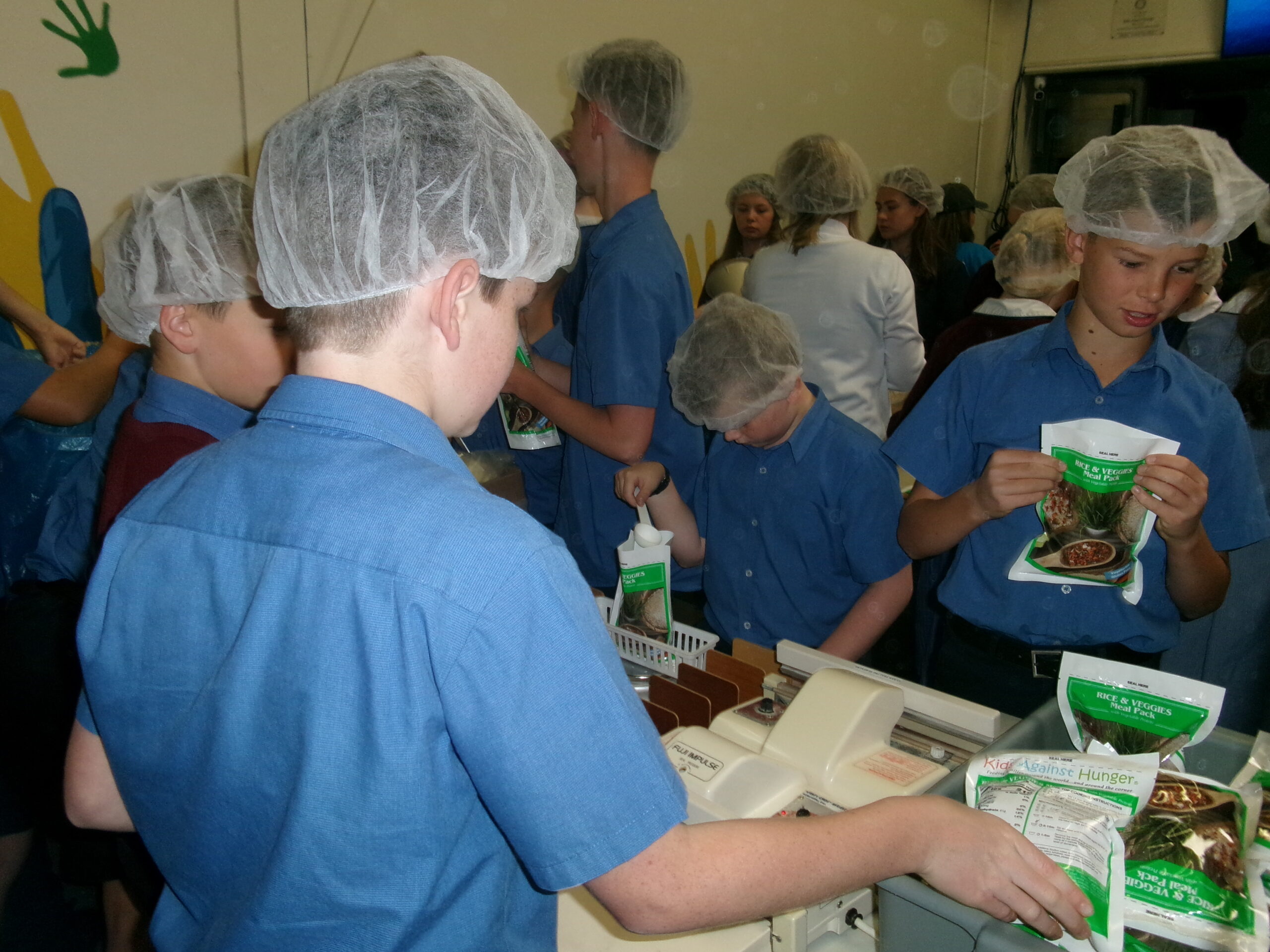 Children packaging small bags of food