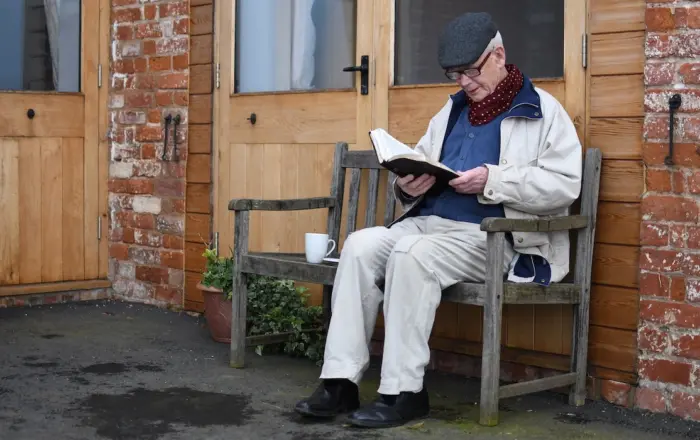 Plymouth Brethren elderly member reading Bible